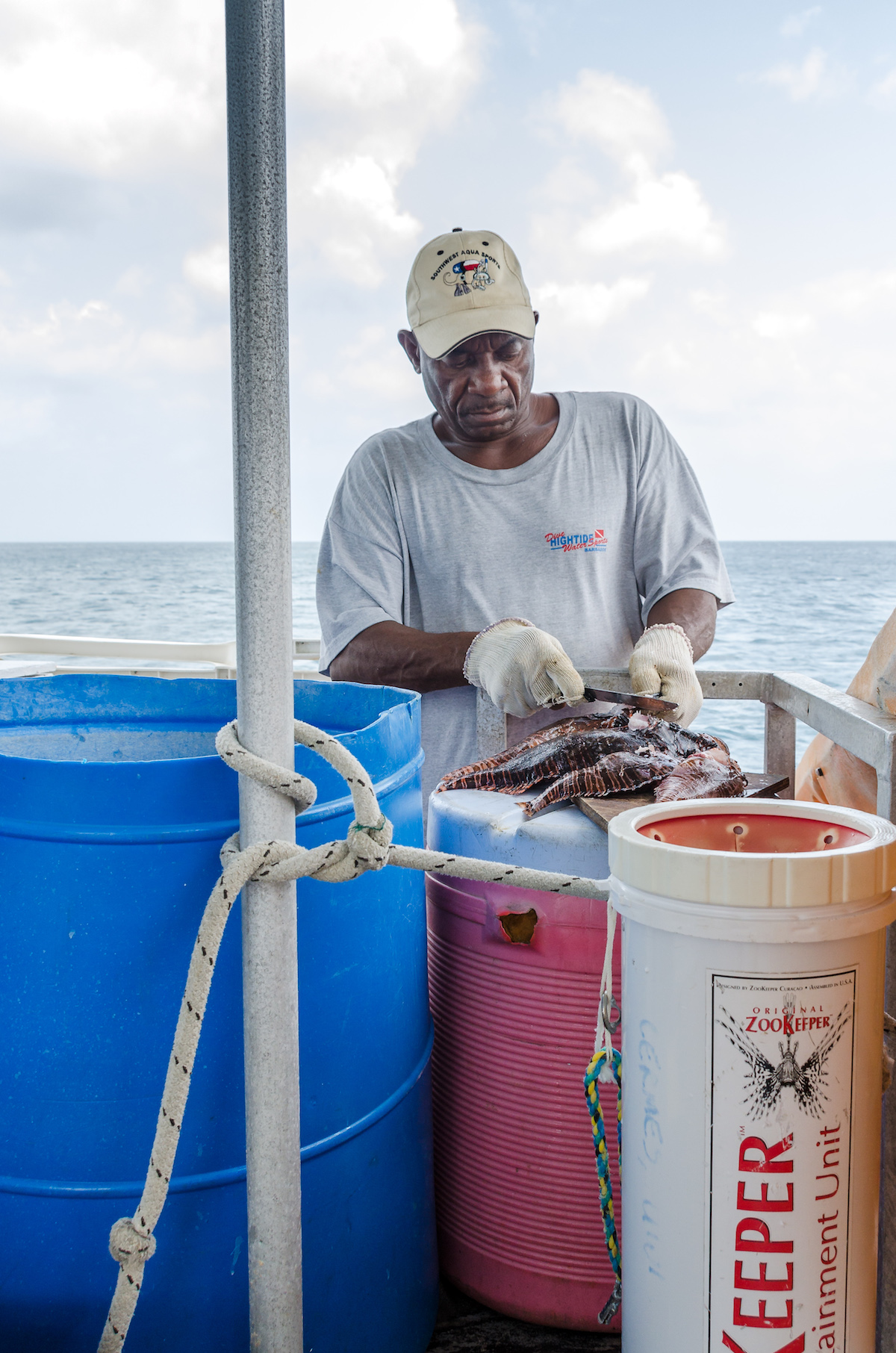 Dive Hightide Captain preparing Lion Fish - About Barbados